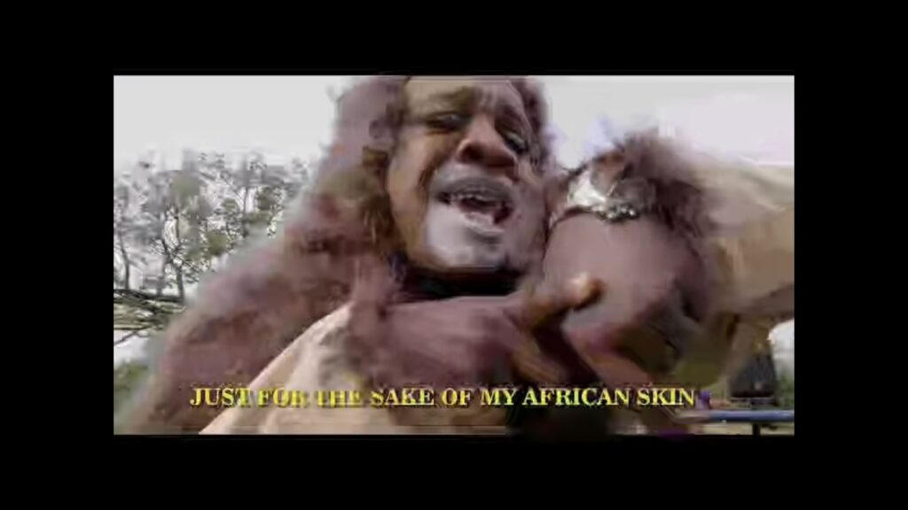 Mighty Mouse John Oboh in a promotional music video dressed as a lion