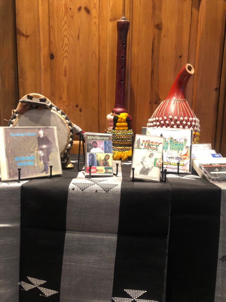A table of musical artefacts and products from John's career